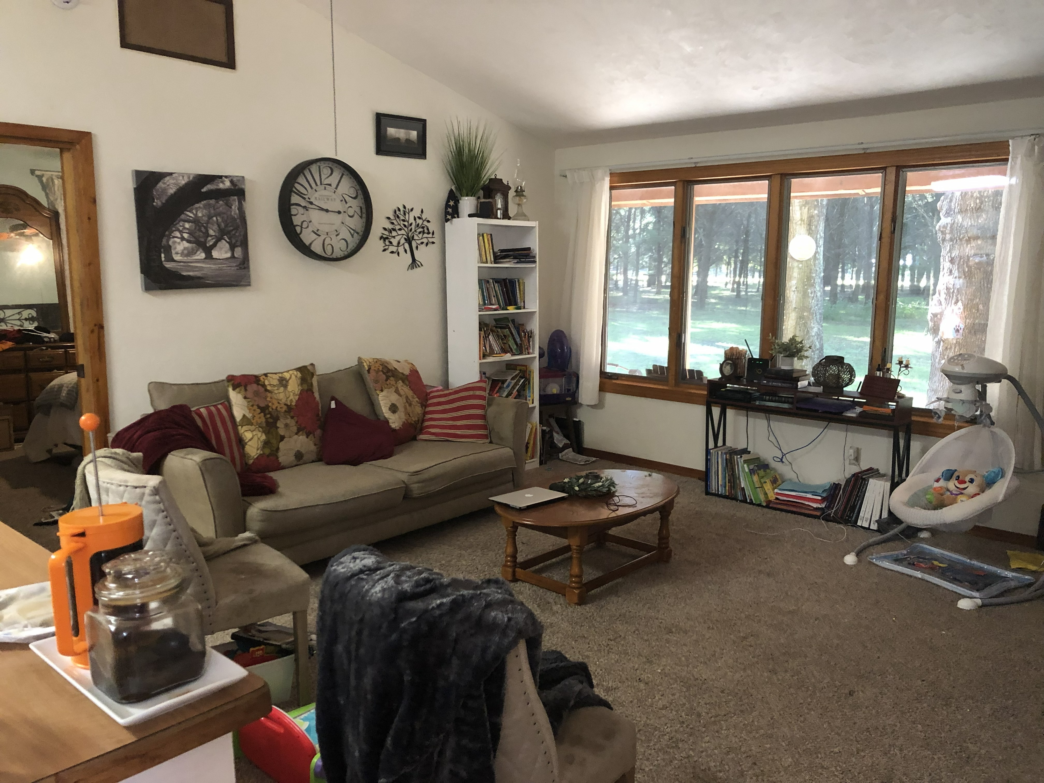 Living Room with large windows and tree view