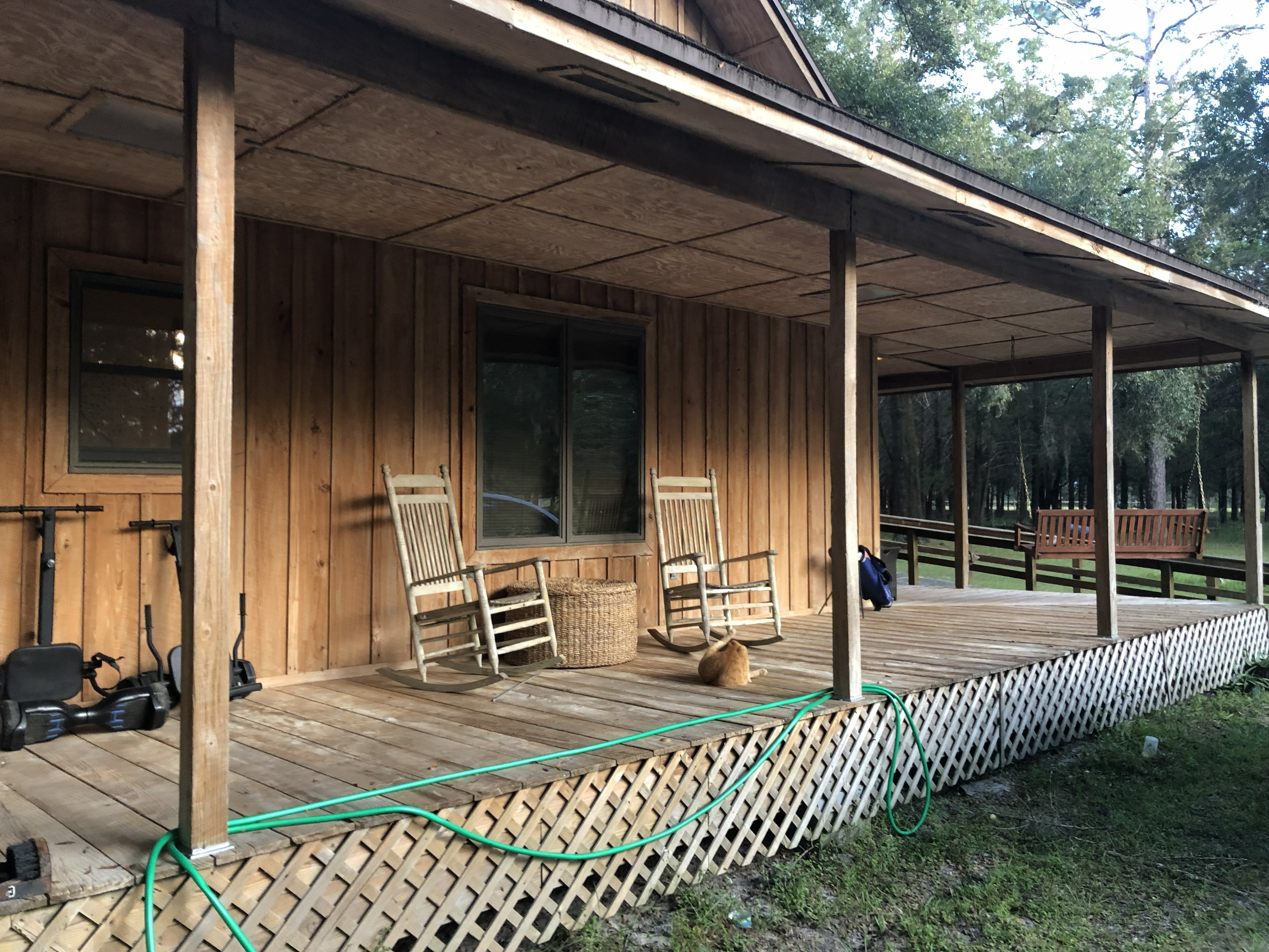 Wrap-around porch with rocking chairs